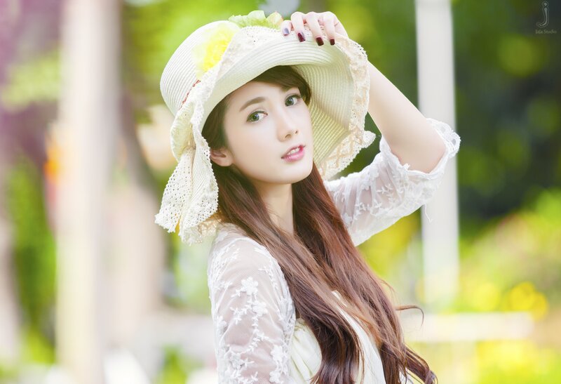 woman in white hat outdoors