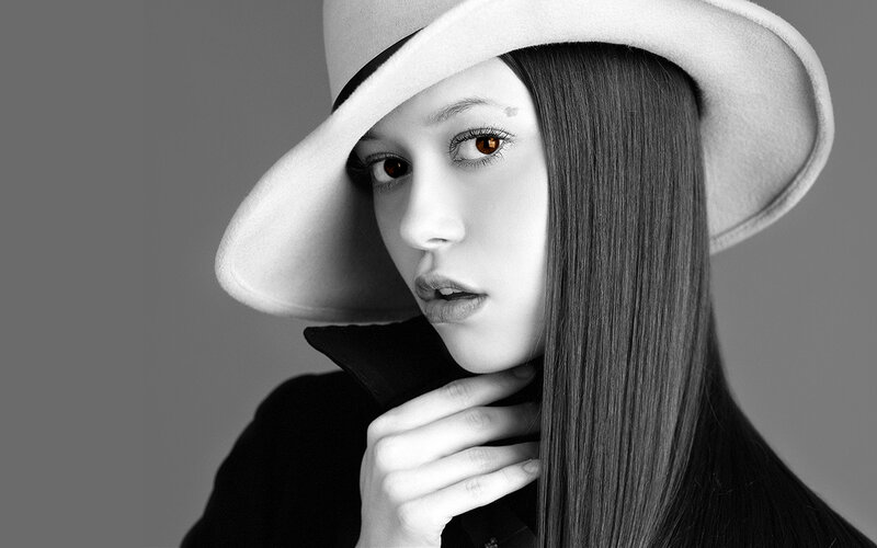 woman in white hat portrait