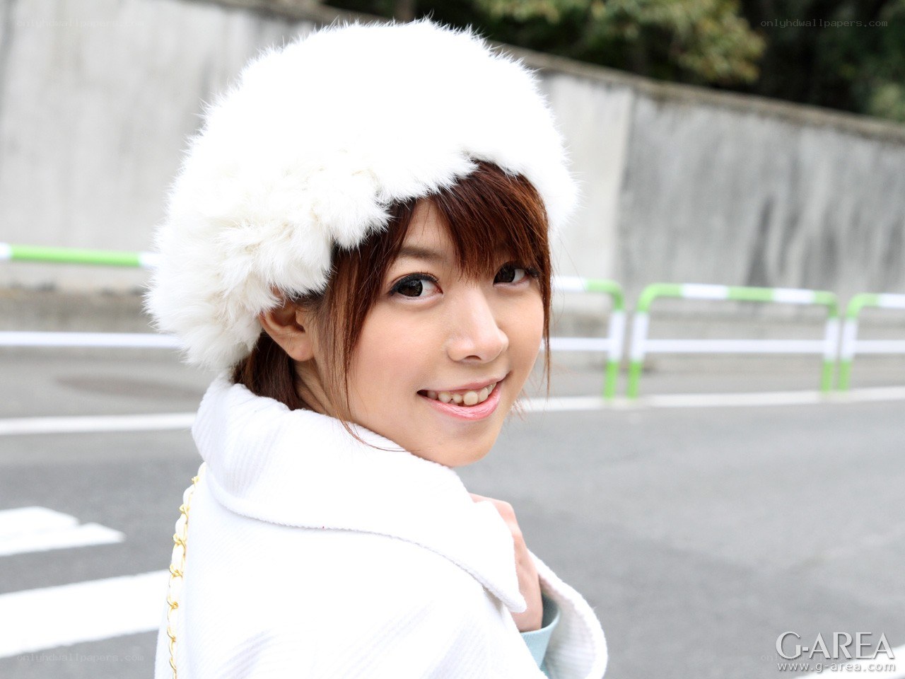 woman in white hat smiling