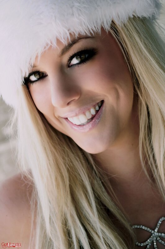 woman in white hat smiling