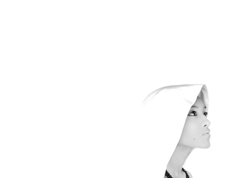 woman in white hood profile