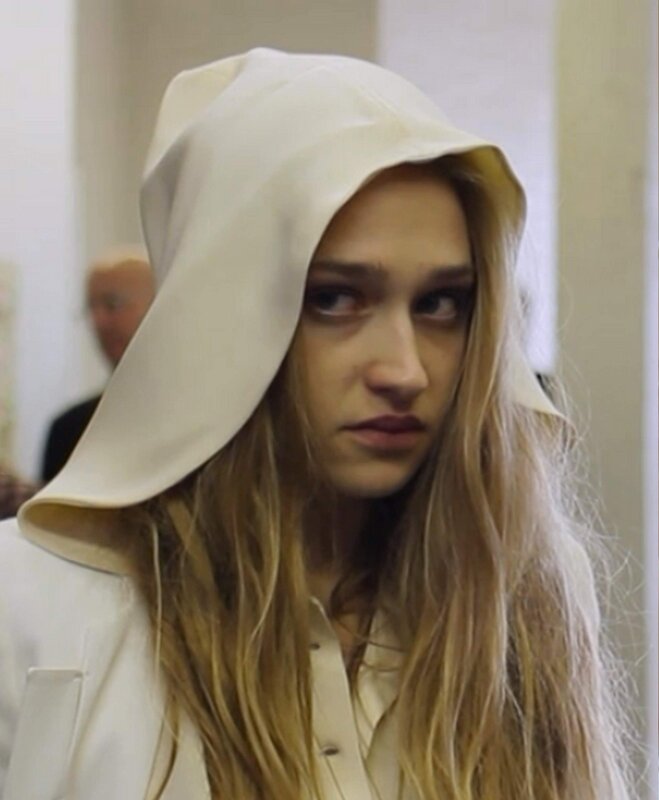 woman in white hooded garment