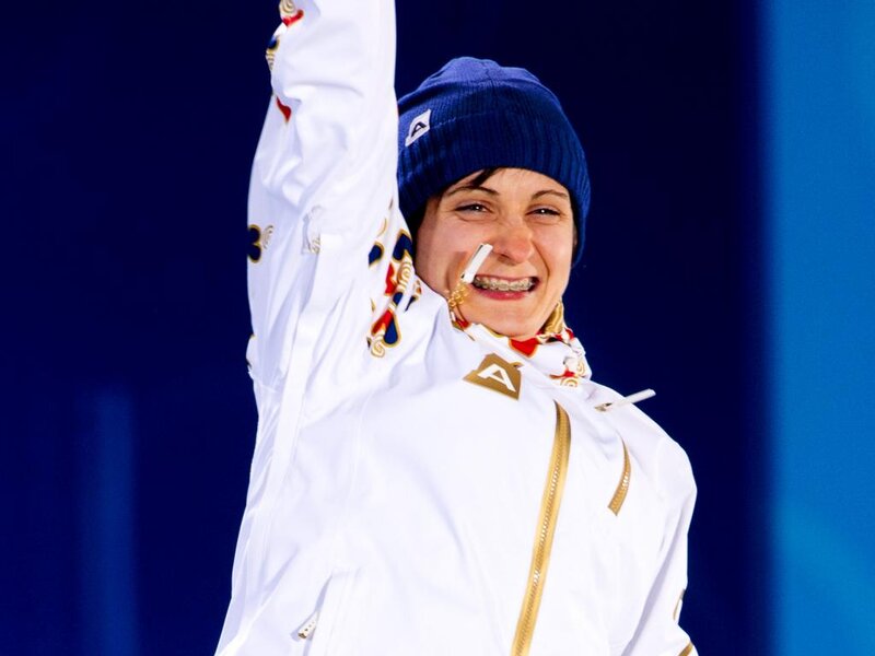 Woman in White Jacket — Celebratory
