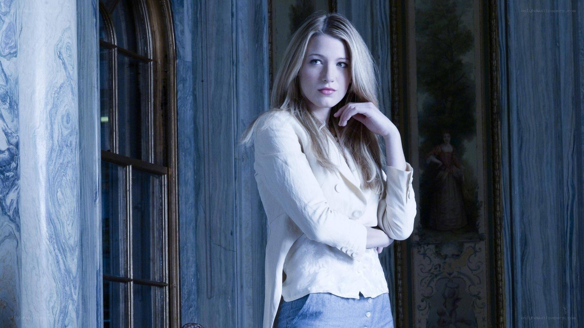 woman in white jacket indoors