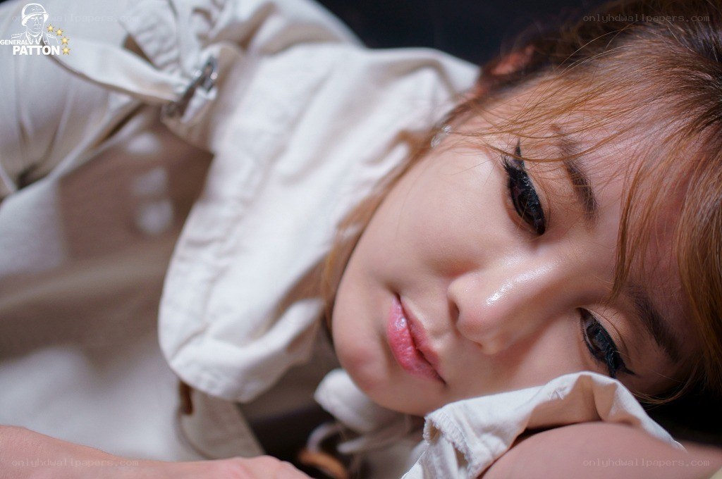 woman in white jacket lying down
