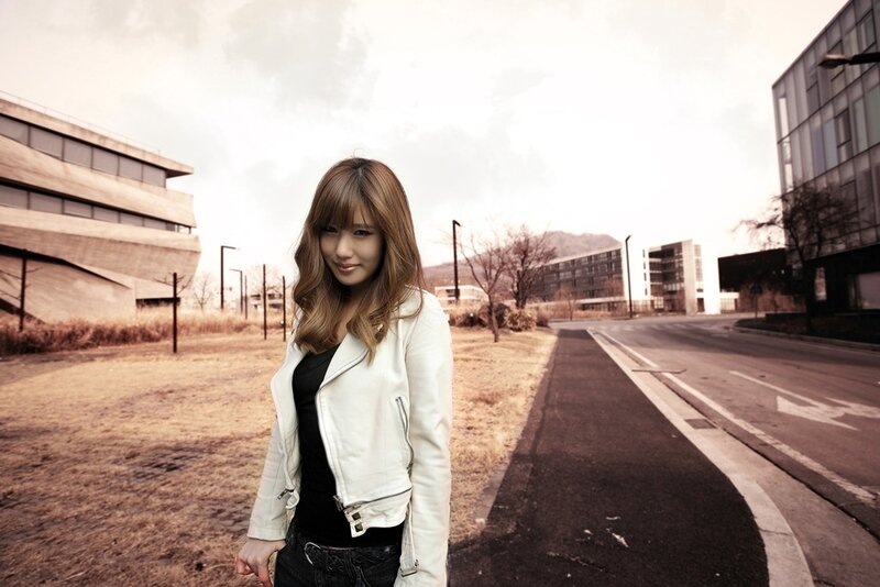 woman in white jacket on street