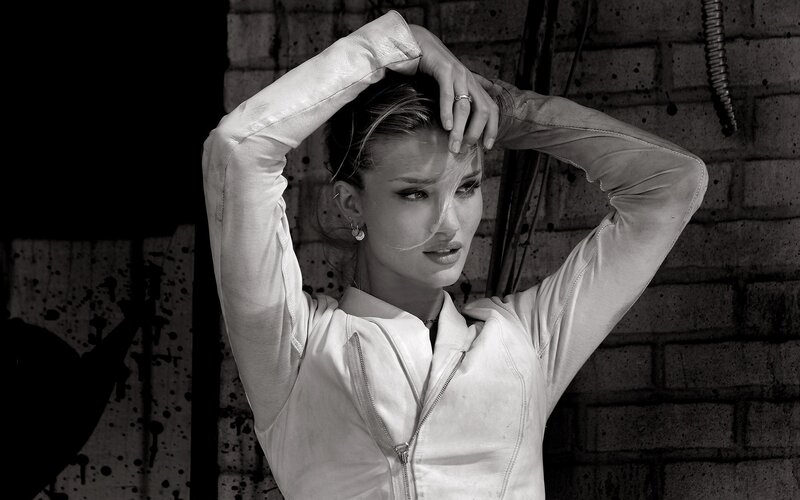 woman in white jacket posing