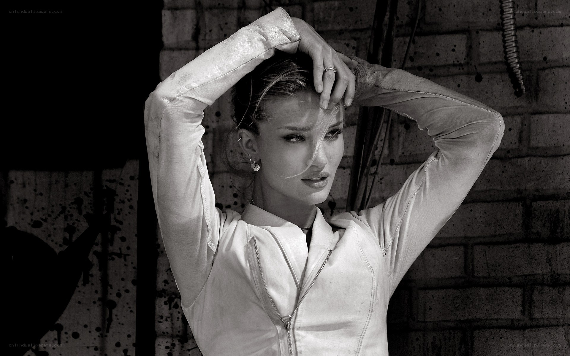 woman in white jacket posing