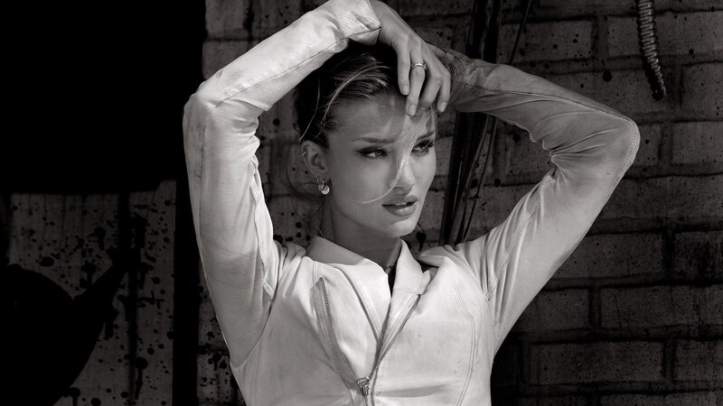 woman in white jacket posing