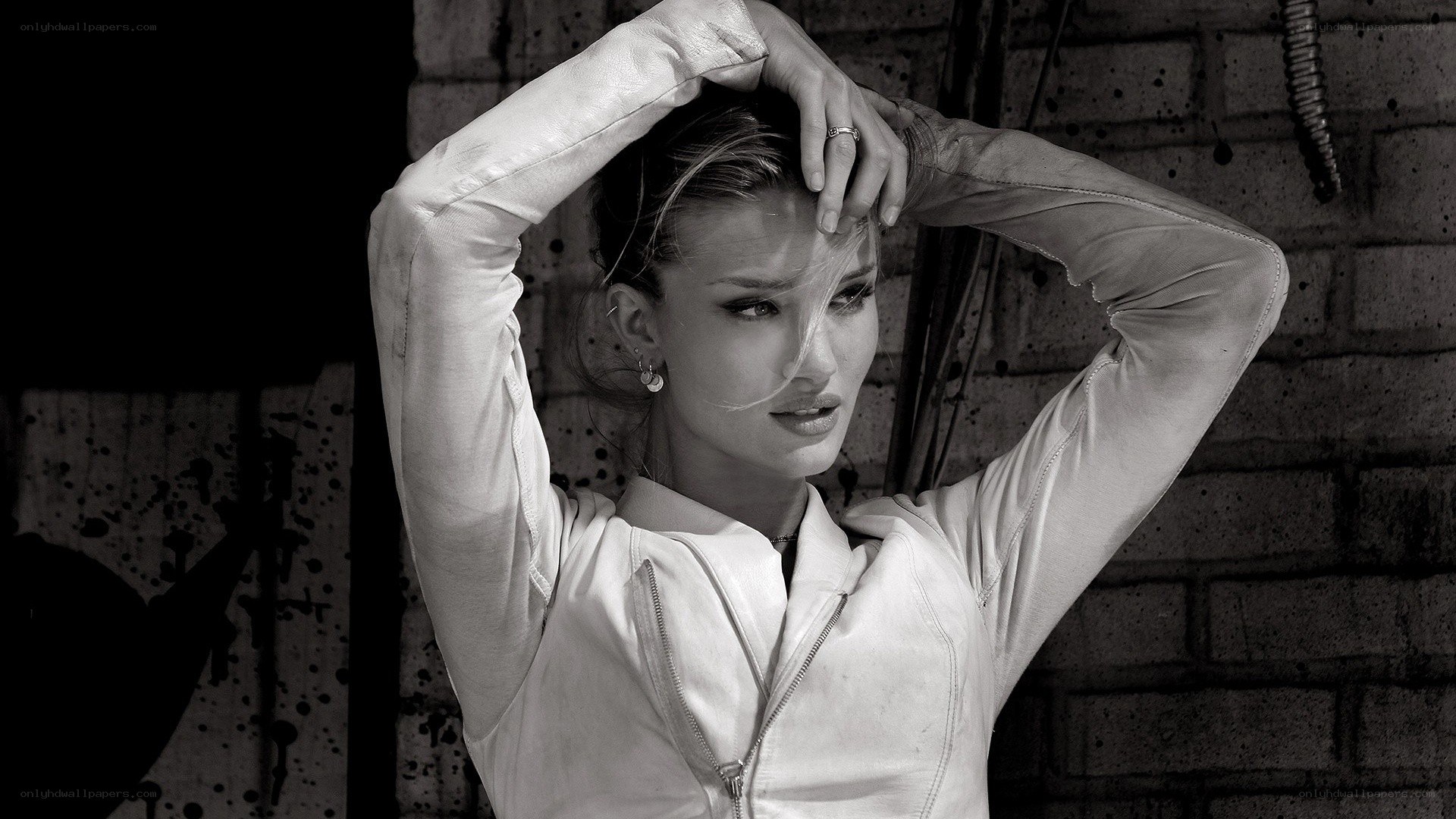 woman in white jacket posing