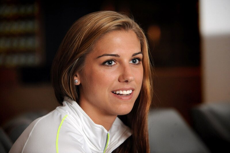 woman in white jacket smiling