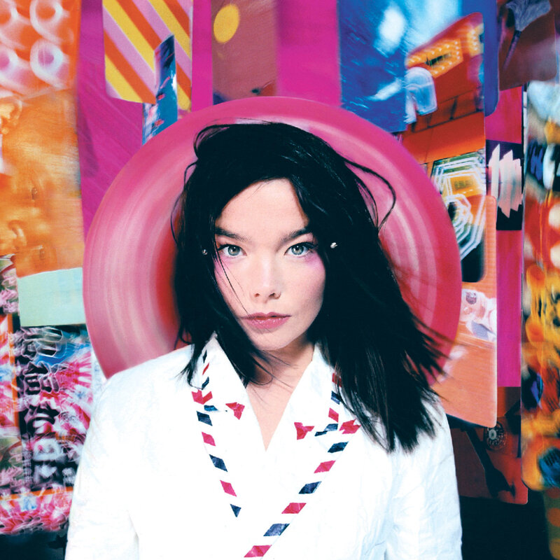 woman in white jacket with colorful background