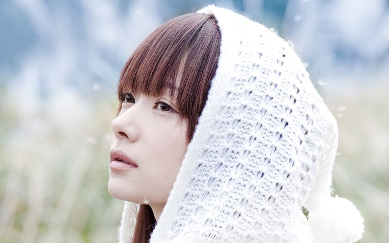 woman in white knit hood