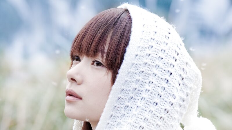 woman in white knit hood
