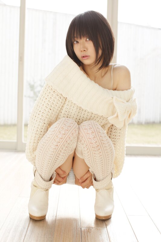 woman in white knit outfit