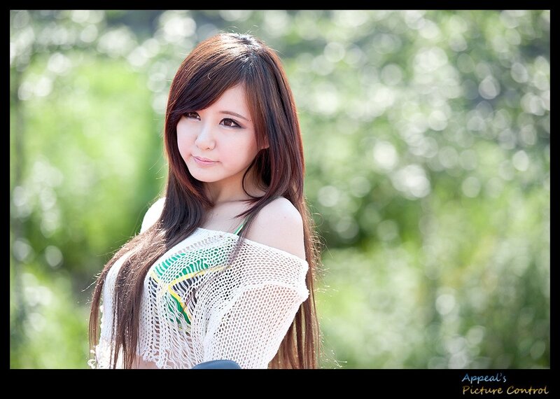 woman in white knit top