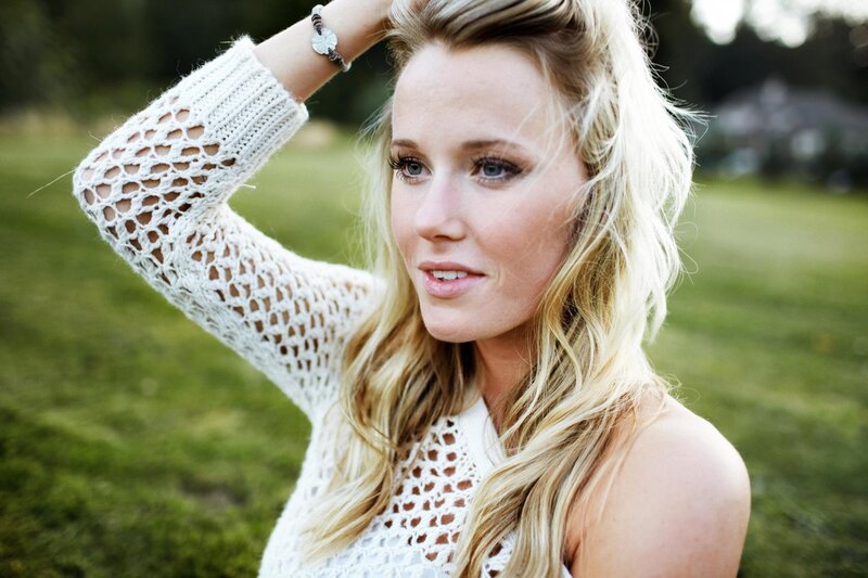 woman in white knit top