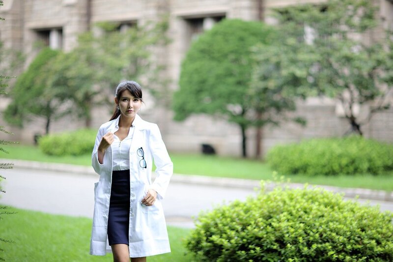 woman in white lab coat