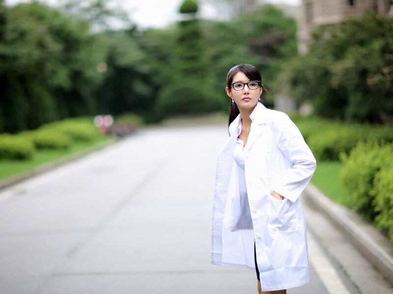 woman in white lab coat