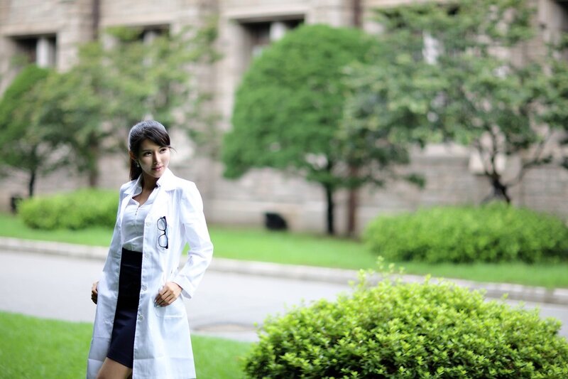 woman in white lab coat