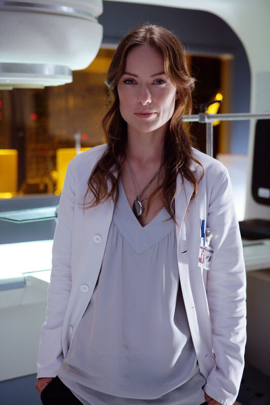 woman in white lab coat