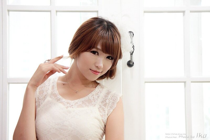 woman in white lace top