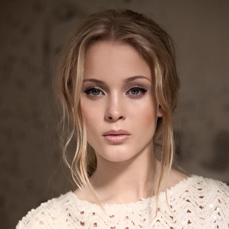 woman in white lace top