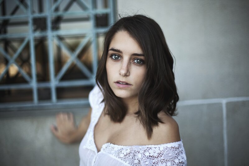 woman in white lace top