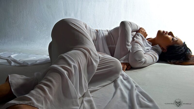 woman in white lying on floor