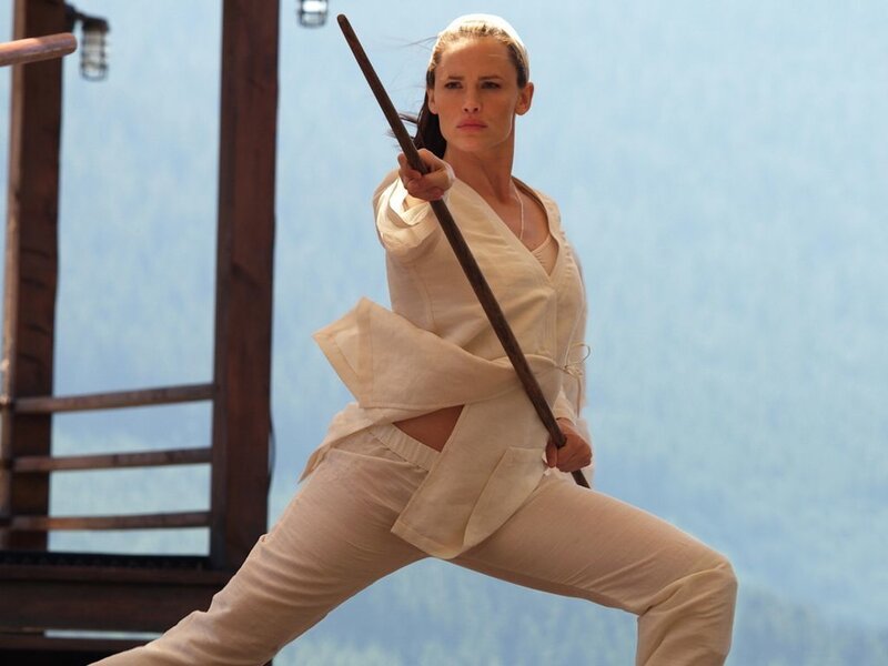 woman in white martial arts uniform