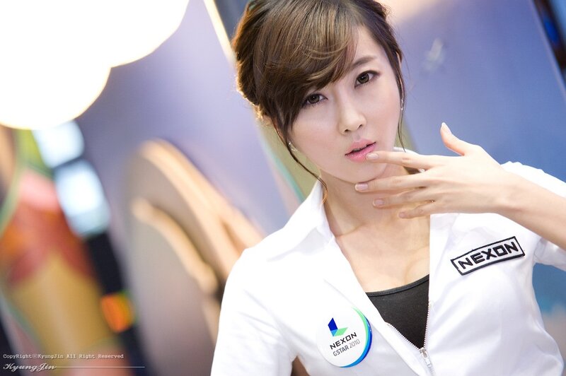 woman in white NEXON jacket