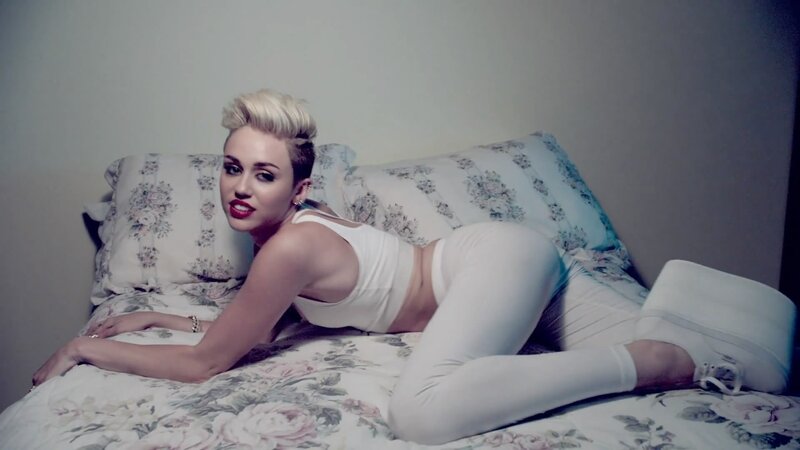 woman in white on floral bed