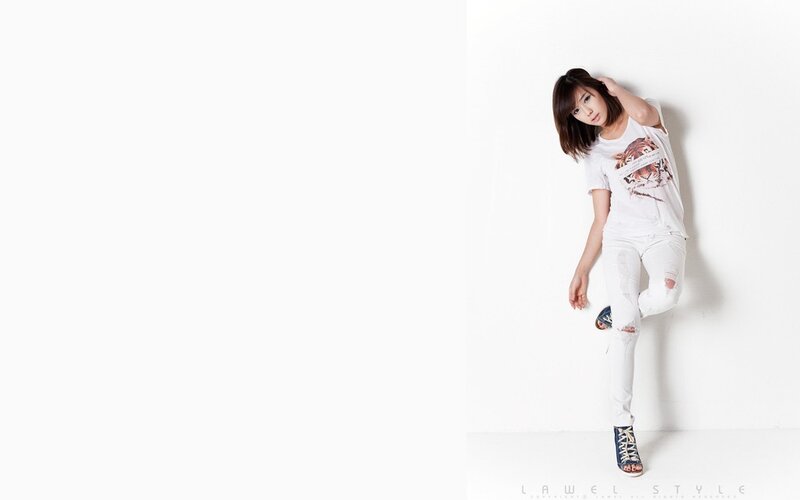 woman in white outfit posing