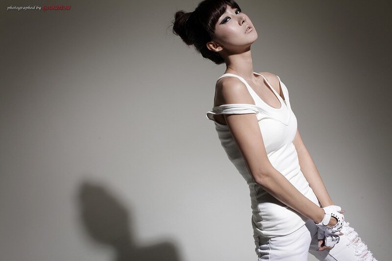 woman in white outfit posing