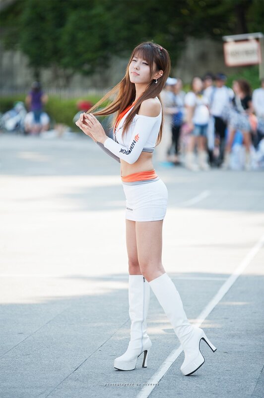 woman in white outfit posing