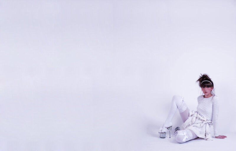 woman in white outfit sitting