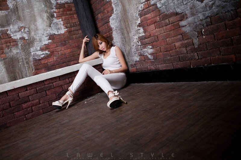 woman in white outfit sitting