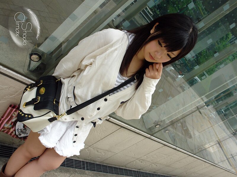 woman in white outfit with bag