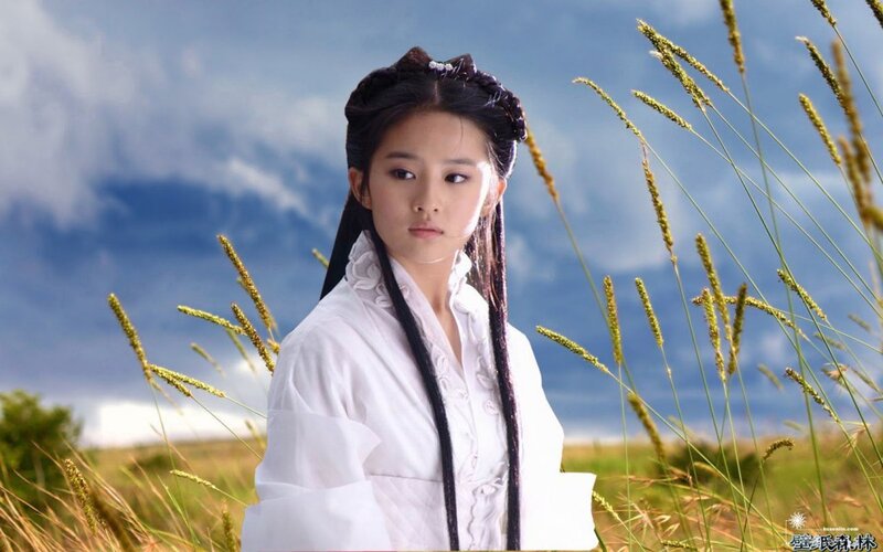 woman in white robe in field