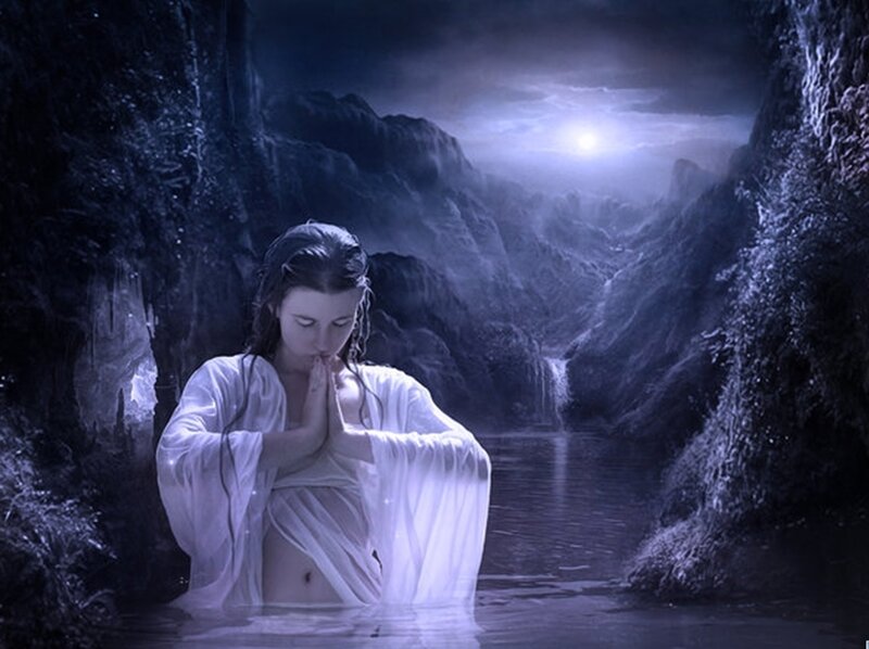 woman in white robe praying