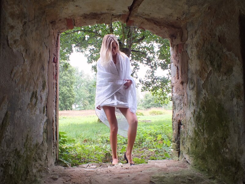Woman in White Robe — Serene, Afternoon, Photograph, Stone Archway