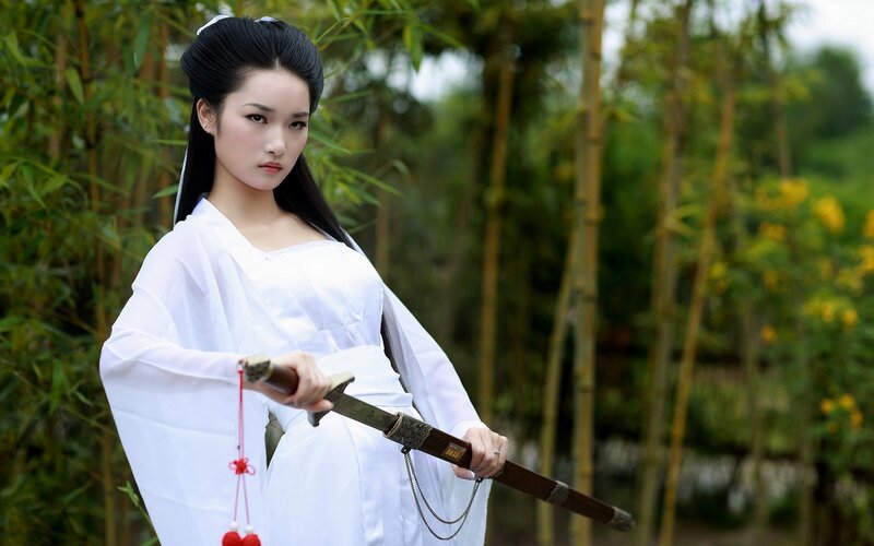 Woman in White Robe — Serious