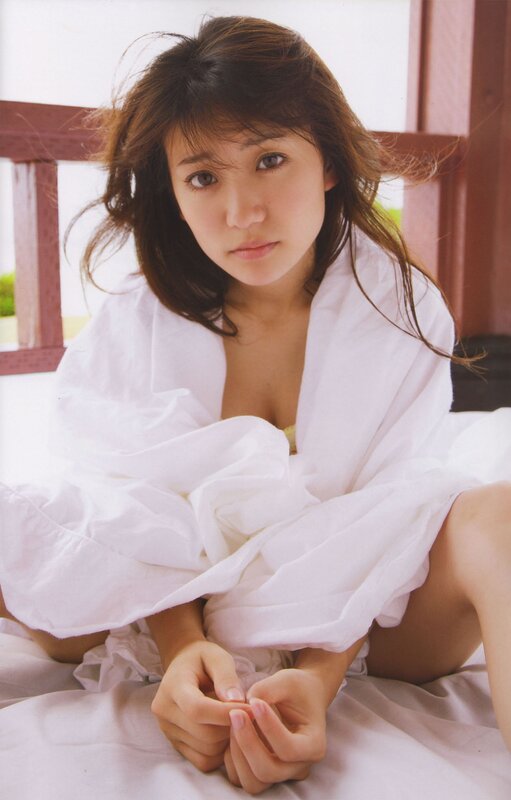 woman in white robe sitting