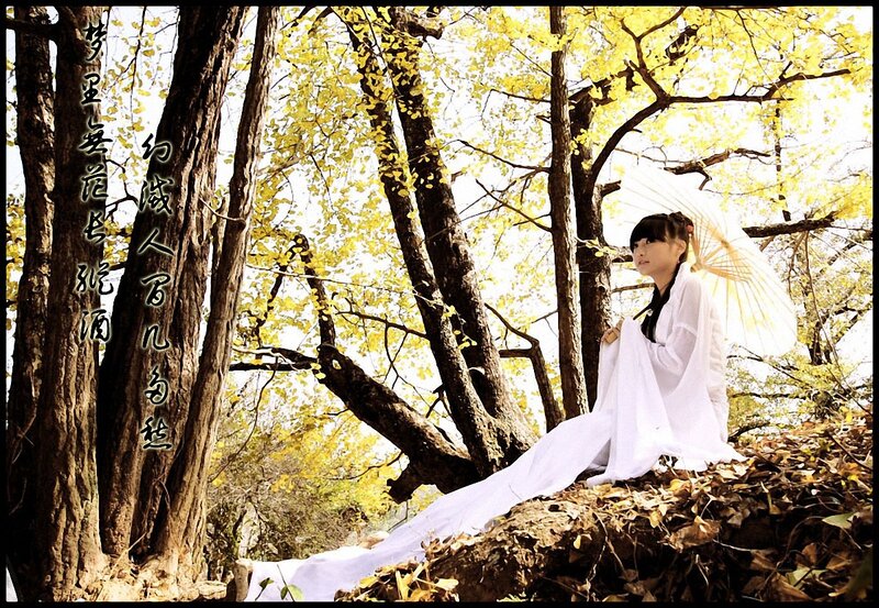 Woman in white robe with parasol