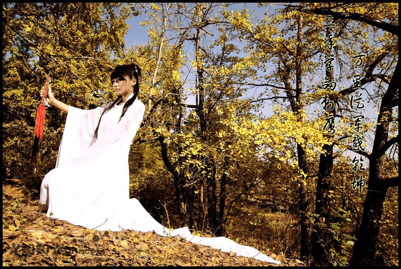 Woman in white robe with sword