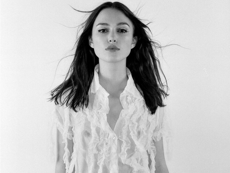 woman in white ruffled shirt