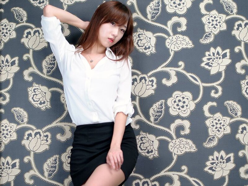 woman in white shirt and black skirt