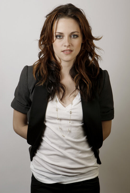 woman in white shirt and black vest