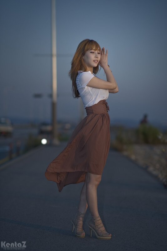 woman in white shirt and brown skirt