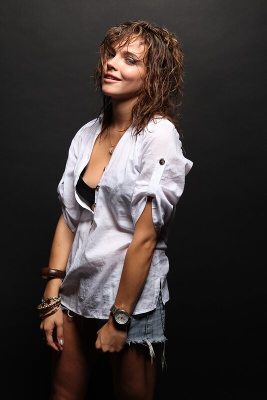 woman in white shirt and denim shorts